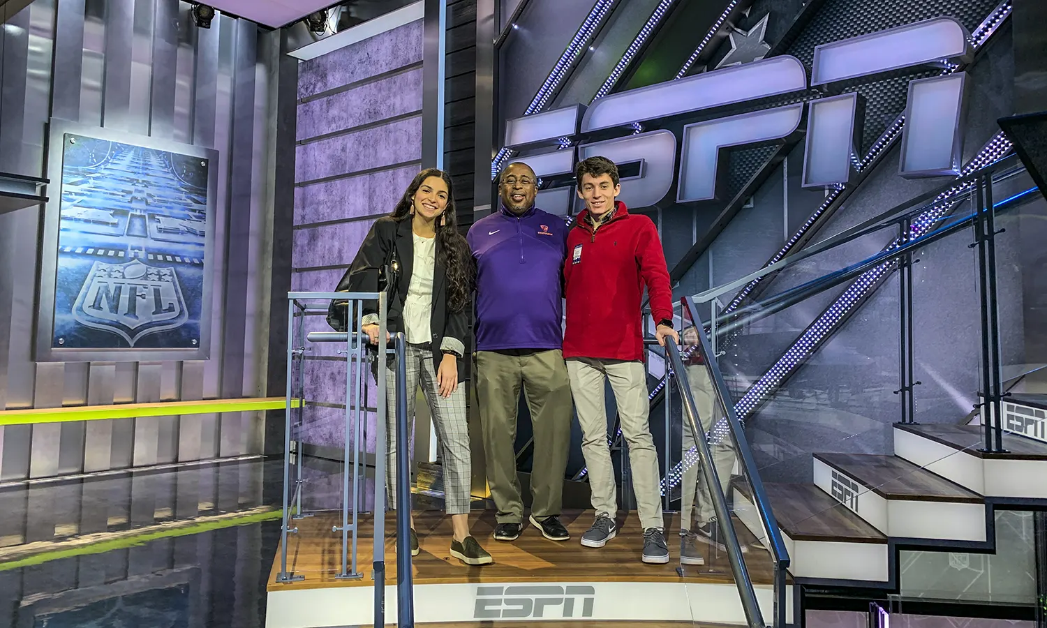 Gianna Gonzalez '20 and Adam Farid '20 tour ESPN in Bristol, Conn., with Trustee Michael Rawlins '80, P'16.