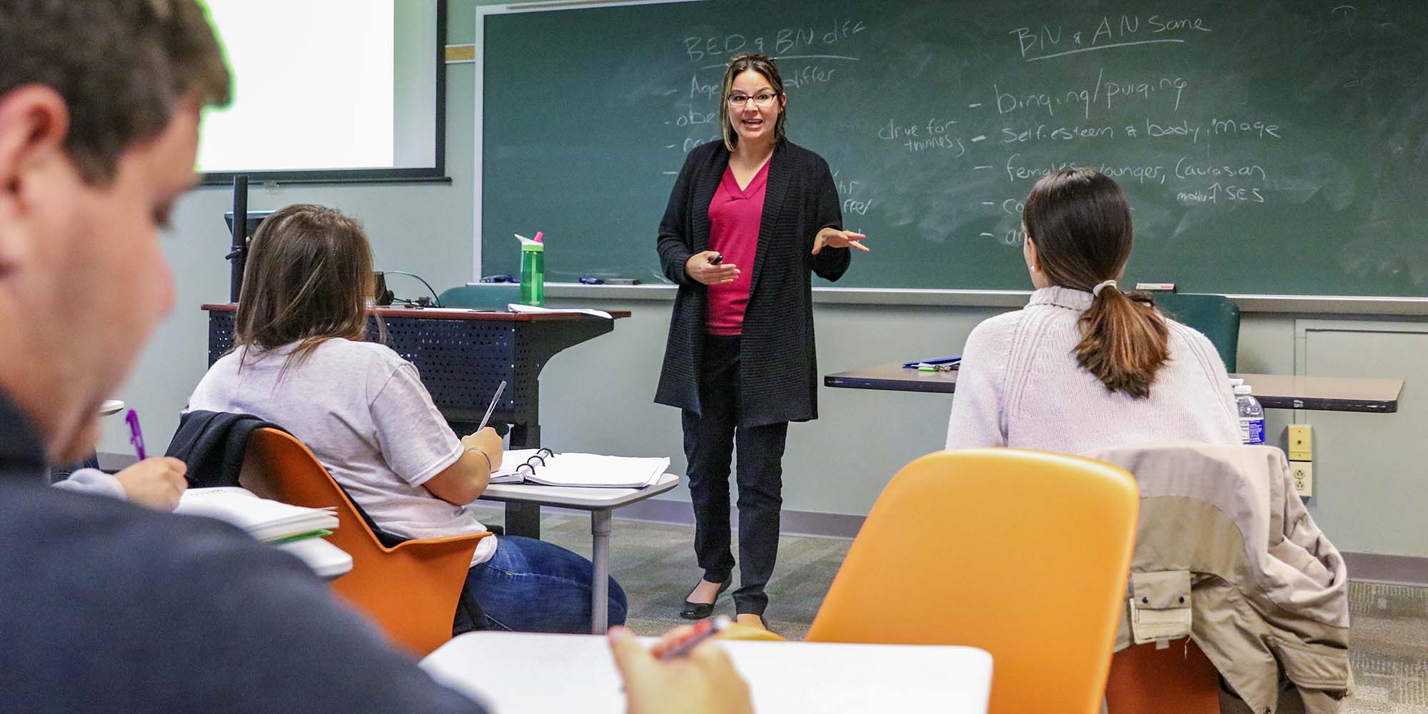 Prof. Jamie Bodenlos teaching in class.