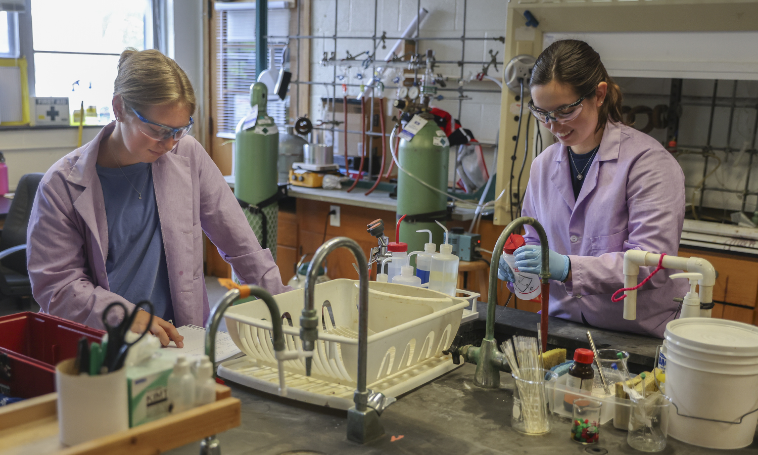 Tess Weber ’23 and Marlayna DiFante ’24 work on the synthesis and characterization of molecular wire candidates in the lab of Associate Professor of Chemistry Christine de Denus.