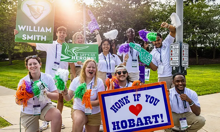 Current students welcome new students to campus.