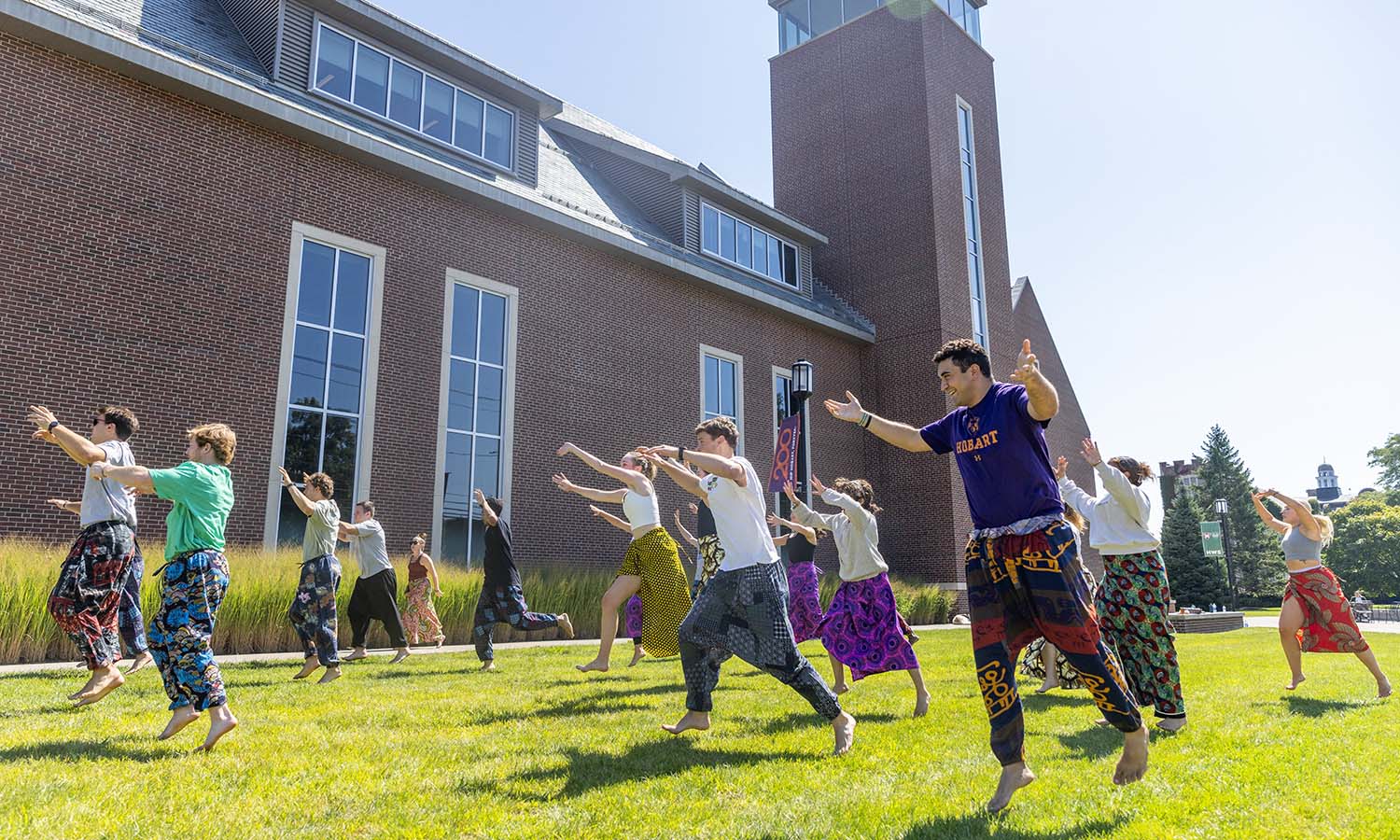 Associate Professor of Dance and Movement Studies Kelly Johnson leads students during “Introduction to Dances of the African Diaspora” in front of the Gearan Center.