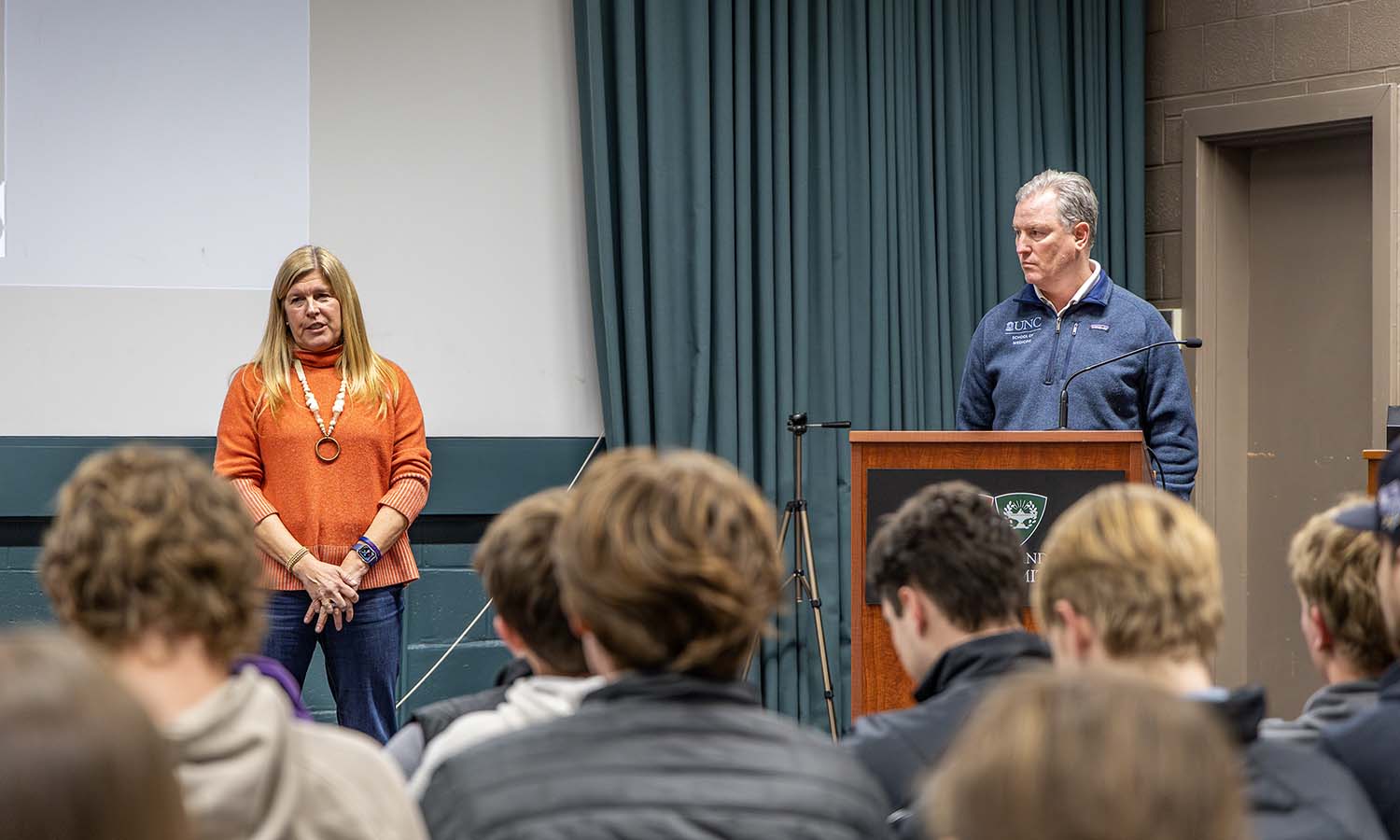 Heather Bonner ’88 and Sean Bonner ’88, founders of the non-profit Mission 34, gather with student-athletes following their discussion on mental health.