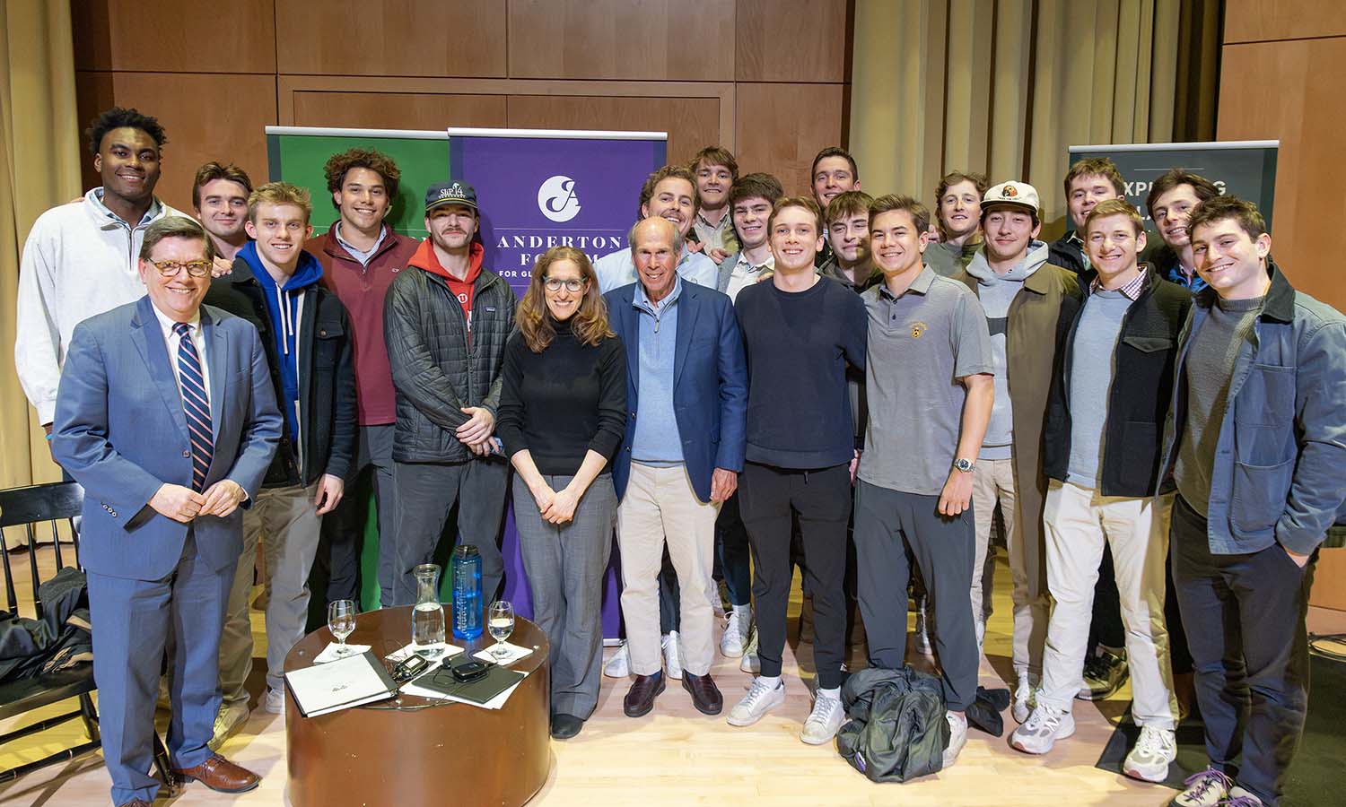 Founder and Executive Chairman of Property Management and Real Estate Investment at Krimson, former Trustee James F. Anderton IV ’65 (center) and author Wendy Pearlman gather with members of Sigma Phi.