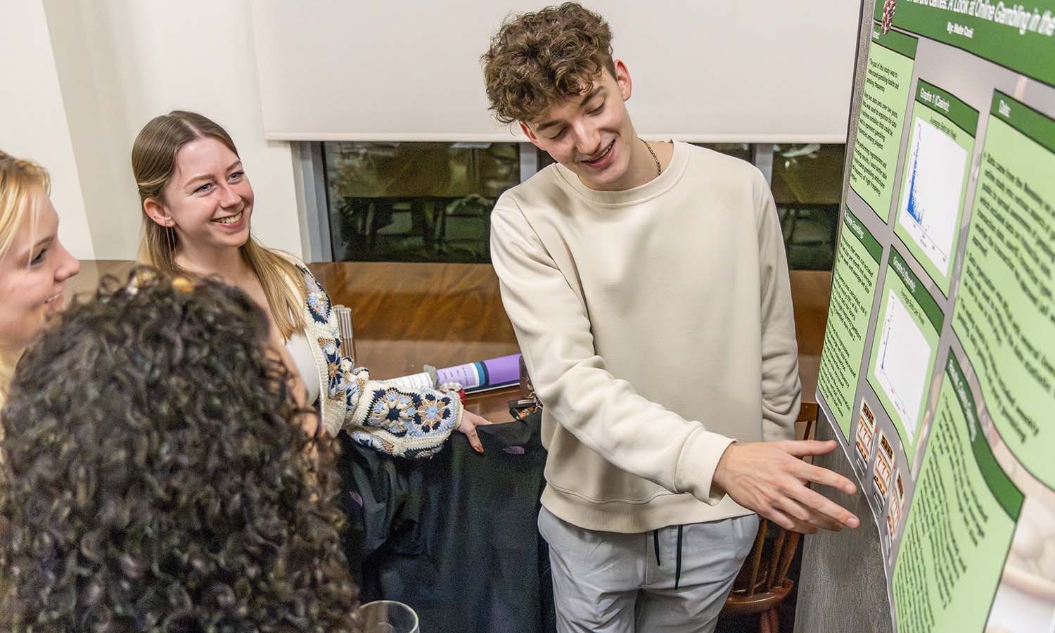 During the “Econometrics” final poster presentations, Nate Conti ’26 answers a question about his research project.