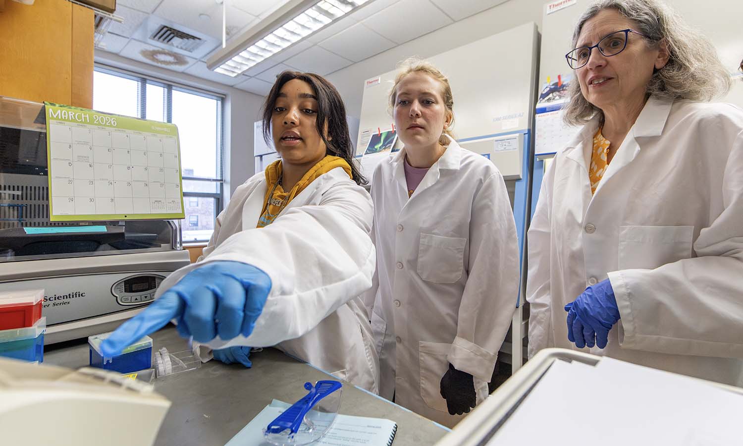 During a lab for “Immunology,” Professor of Biology Patricia Mowery teaches Ariel Messenger ‘26 and Genevieve Larkin ‘27 how to count tissue culture cells.
