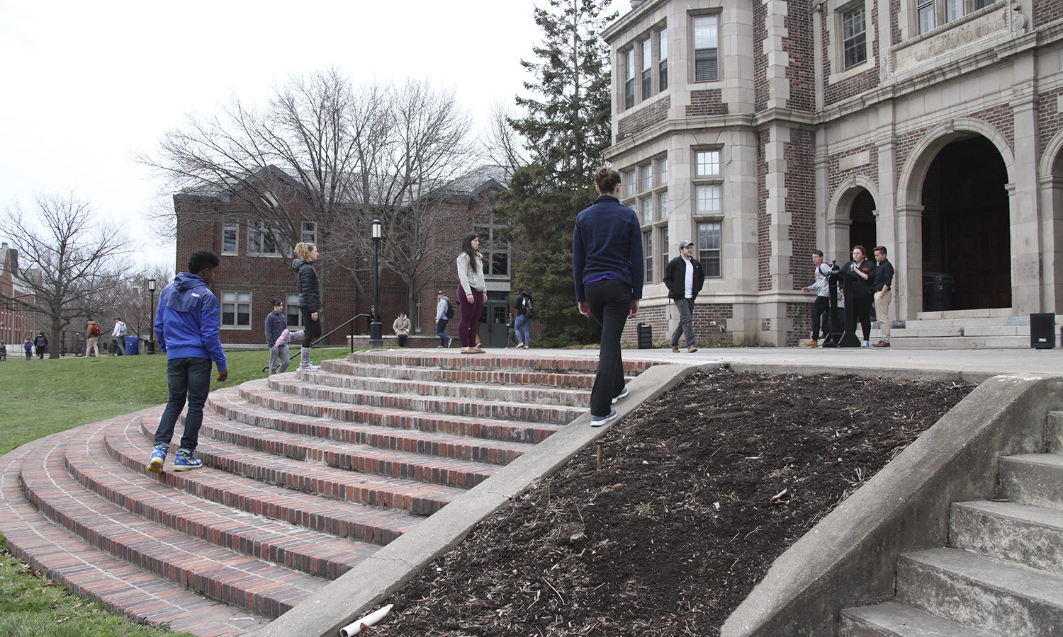 Students rehearse a dance on the steps of Coxe Hall