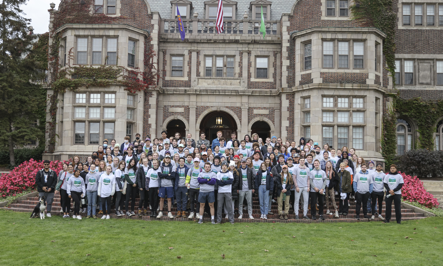Students participating in Day of Service gather on the steps of Coxe Hall