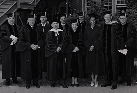 From left to right, Honorary Degree recipient George N. Maybee, Honorary Degree recipient and Trustee Cebern L. Lee, Honorary Degree recipient Lee H. Bristol, President Louis Hirshson, Honorary Degree recipient Thomas Augustus Fraser ’38, Elizabeth Blackwell Award recipient Annette Kaplun-Le Meitour, Honorary Degree recipient Roy W. Moore Jr., Maria Cole (Mrs. Nat King Cole), Merle Gulick, and Honorary Degree recipient Seth N. Genung ’15 at Commencement in 1965. Maria Cole was in attendance to receive her husband’s honorary degree from the Colleges.
